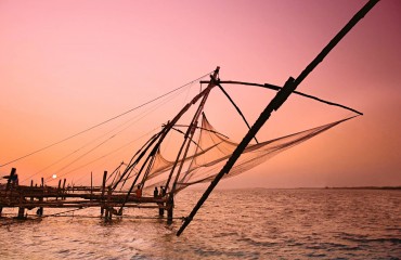 Fishermen and traditional fishing nets Fort Cochin Kerala